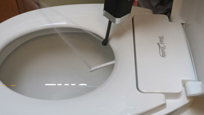 CubeJet spray demonstration on a toilet seat